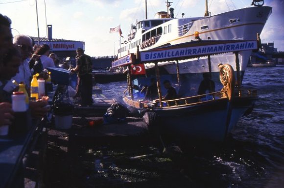 Grilled fish seller front of ferry