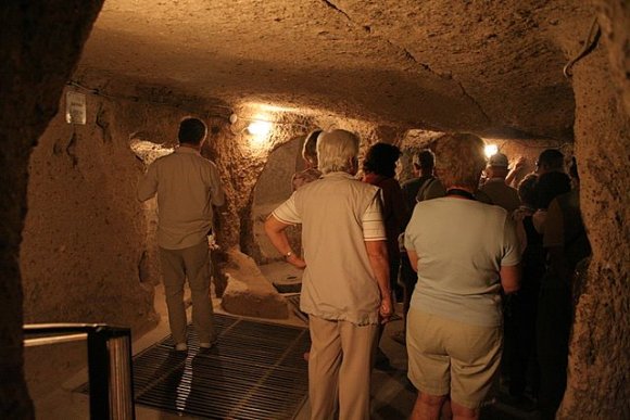 Tourist inside Kaymaklı Underground City.